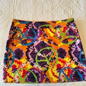 Loudmouth Golf Skort Size 10. Colorful Woodstock Peace Signs pattern.